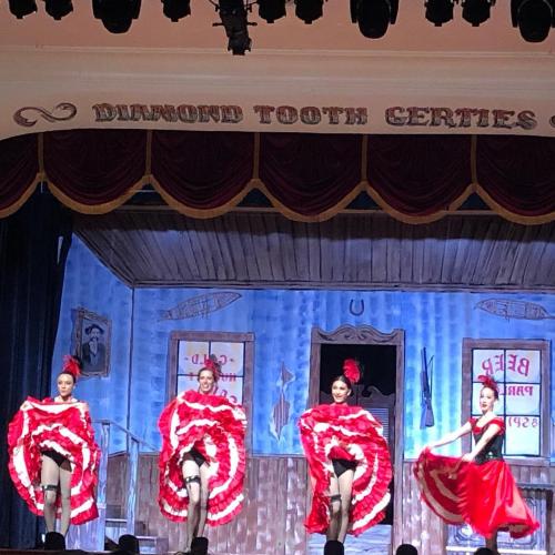 gertie's can can dancers on stage in red and white skirts